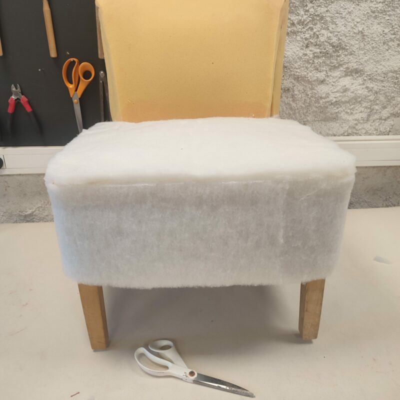 Polyester wadding on a seat before a loose cover