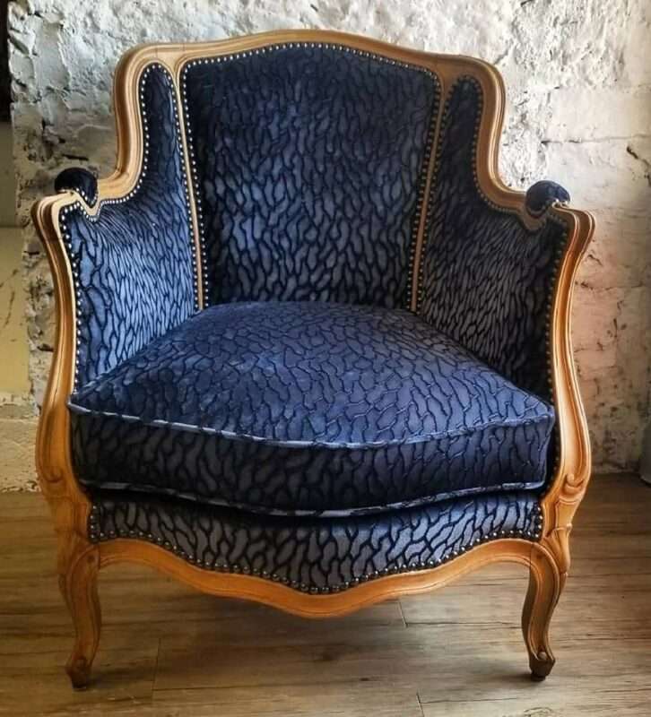 Bergère armchair reupholstered in blue velvet