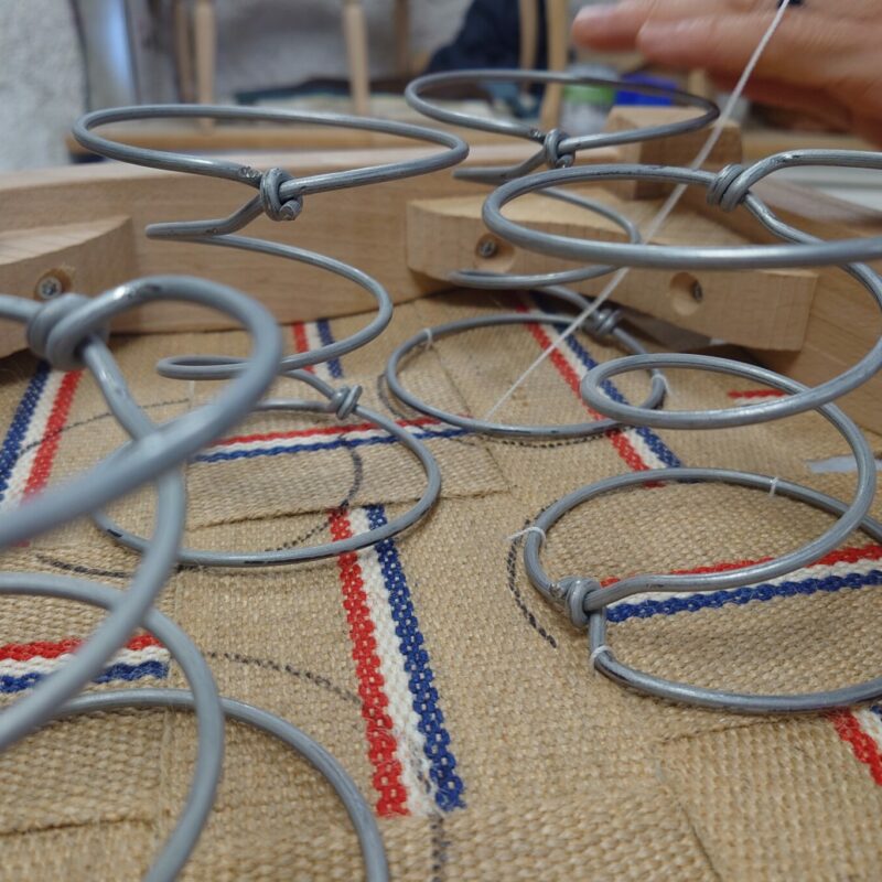 Sewing springs on the webbing