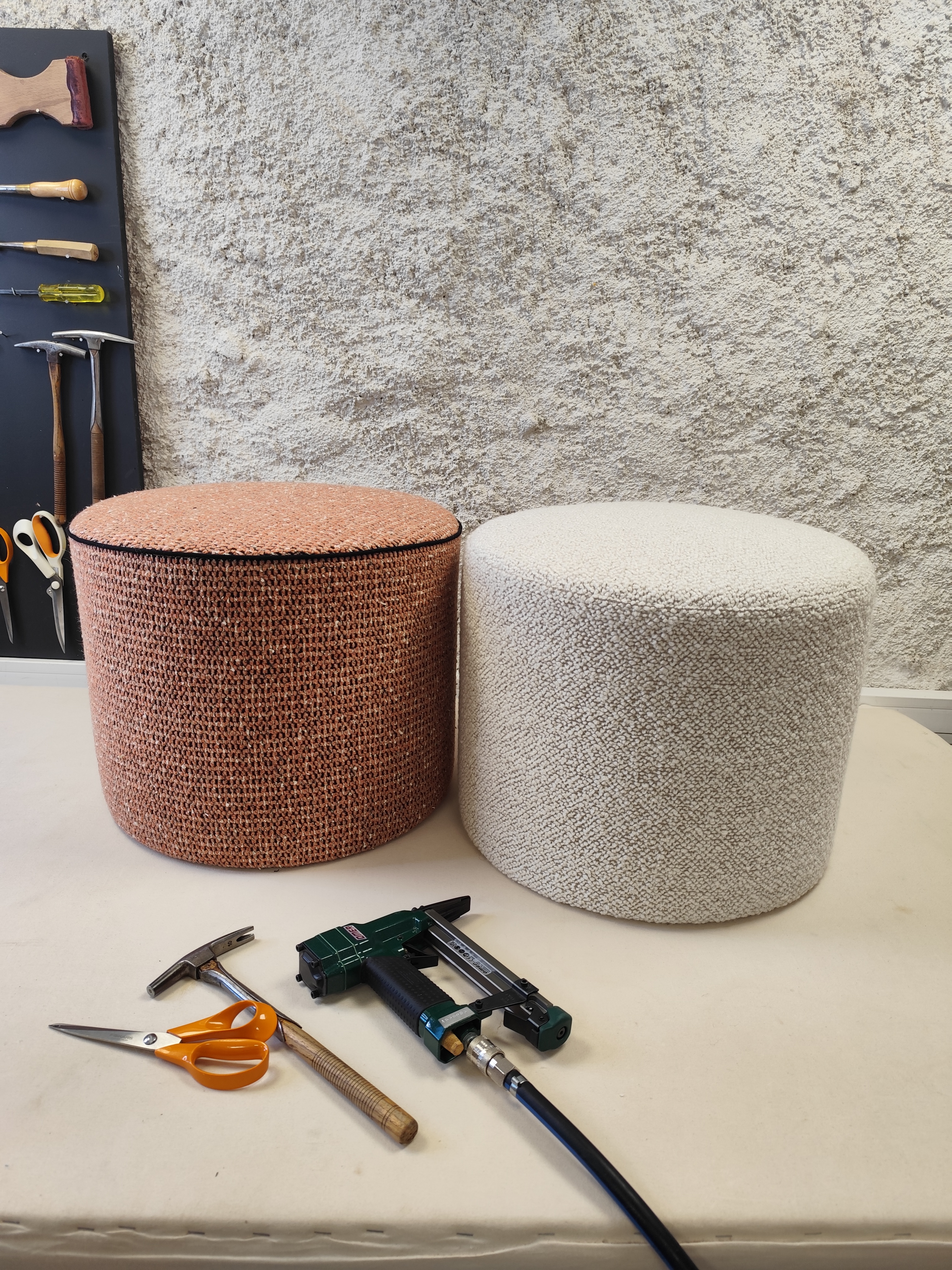 Finished foam pouf with a taut fabric cover