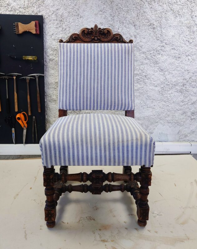 Napoleon III chair before reupholstering, with striped fabric and minimal trim from a previous restoration