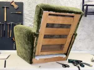 covering the outside back of a club chair
